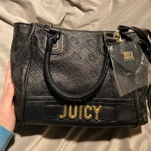 Black juicy couture purse with removable long cross body strap and two handles